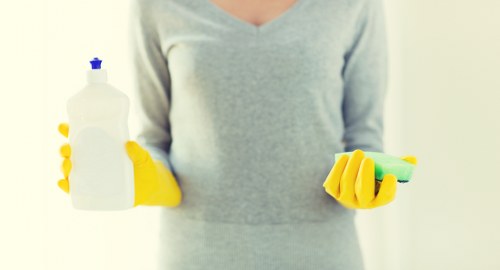 Professional cleaners maintaining a Chelsea office kitchen and communal area