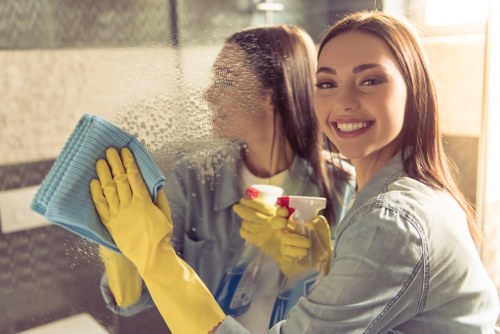 Professional cleaner handling Airbnb changeover in a Chelsea property