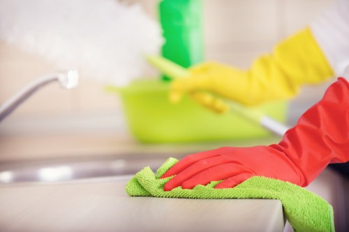 Turnaround cleaning tasks in a Chelsea short-let kitchen and living space